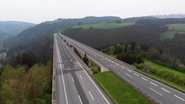 Aerial View of the Highway Viaduct on Concrete Pillars in the Mountains