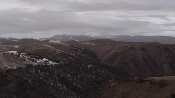 Car in the Mountains of the Caucasus in Winter