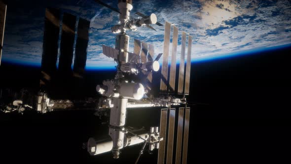 International Space Station in Outer Space Over the Planet Earth alt
