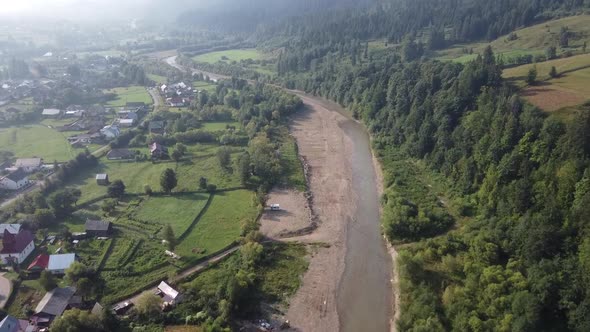 Small River Near Village, Rural Aerial View