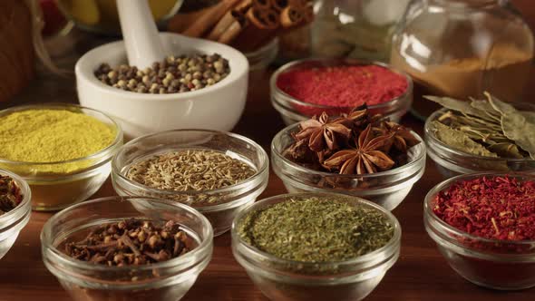 Various Spices in Glass Bowls Closeup