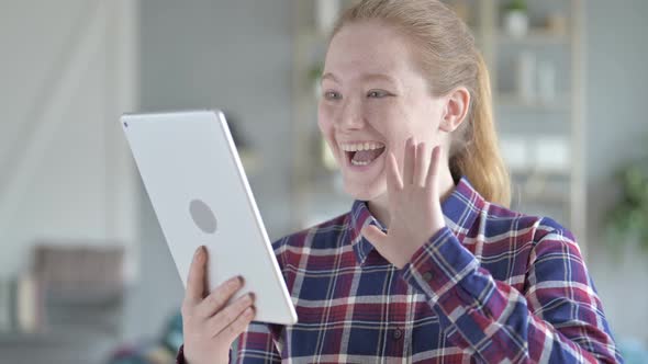 Young Woman Video Calling on Tablet