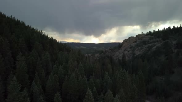 Aerial View of Storm Clouds Looming in the Distance in the Mountains of Colorado, Forward Motion