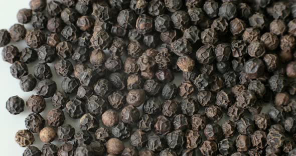 Detail of Peppercorns on a white plate