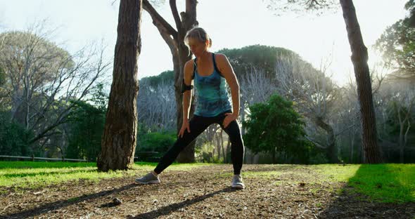 Senior woman exercising in the park 4k