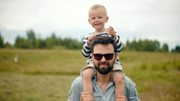 Happy Family Father And Child Boys Leisure. Son Boys Walking Happiness. Cute Little Kid Having Fun.