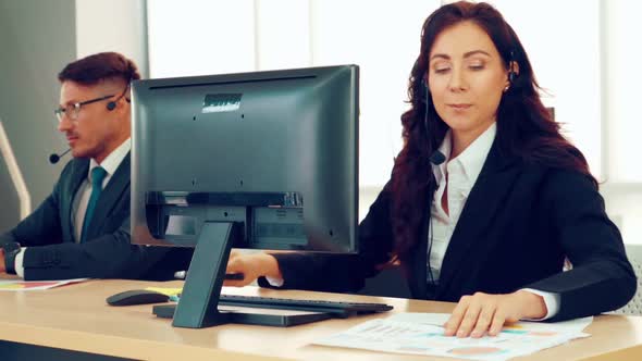 Business People Wearing Headset Working in Office