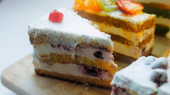 Pieces of Different Cakes on a Retrostyle Baking Tray