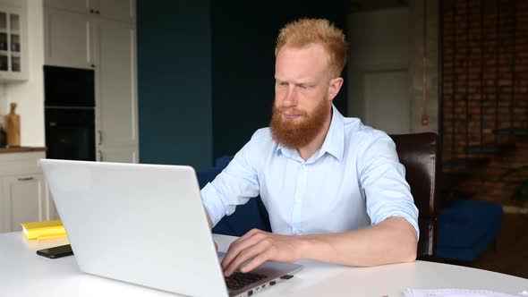 Tired Red Haired Businessman Massaging Back of the Neck Feels Muscle Tense