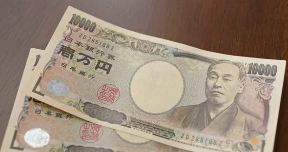 Counting Japanese yen banknote