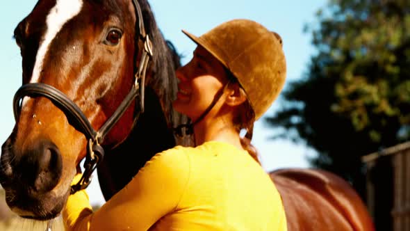 Woman standing with the horse in the ranch 4k