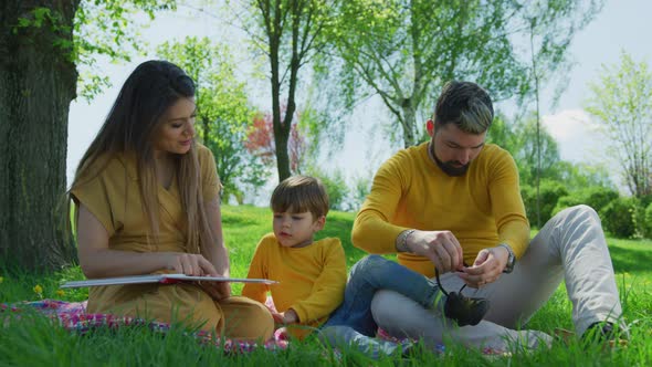 Mother reading a book to her child