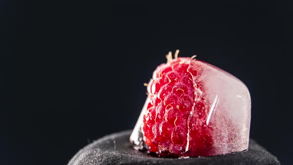 Timelapse Raspberry Melts and Freezes in a Piece of Ice in a Loop