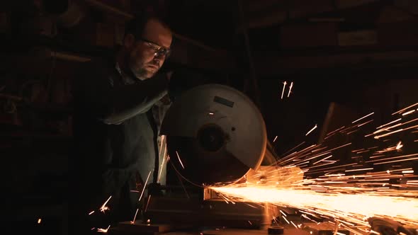 Man Works With Big Electric Grinder.