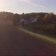Aerial Video Approaching A Farm During Sunset At Low Height - VideoHive Item for Sale