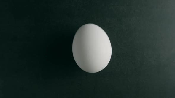 A White Egg Is Spinning on the Table