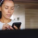 Attractive Young Mixed Race Girl Using Fitness App on Mobile Phone in the Gym - VideoHive Item for Sale