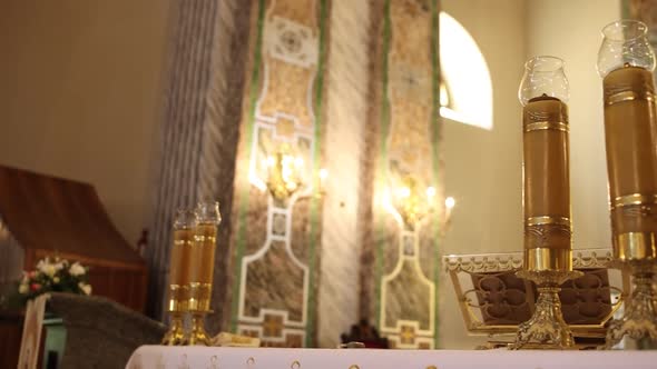 large beautiful candles on the table at the pastor in the catholic church