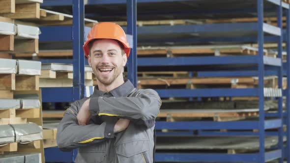 Professional Industry Worker Smiling Wearing Hardhat Smiling To the Camera