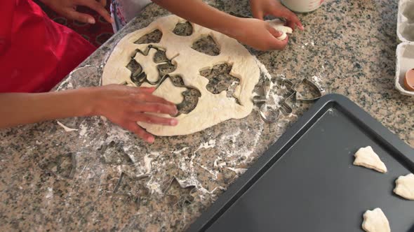 Family making Christmas cookies at home