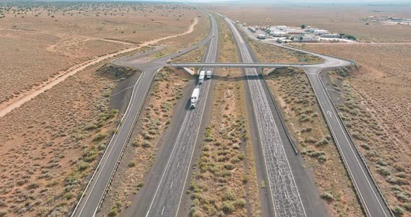 Aerial Scenery Top View of Rest Area with Large Car Park Near Asphalt Interstate Roadside Crossing