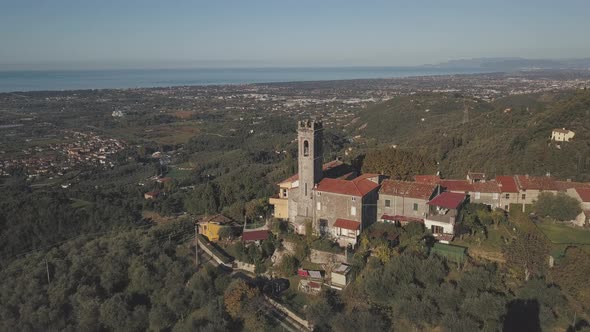 Parallax Drone Shot of Chiesa di Santa di Lucia over the Tuscan Cost and Lido di Camaiore