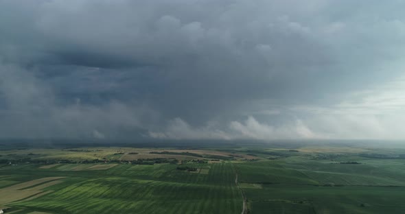 Through The Clouds Opens A Beautiful Landscape Of Fields And Roads With Transport