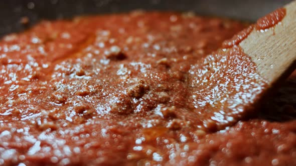 In a Frying Pan with Vegetable Oil Fry Minced Meat Onions and Carrots with Tomato Paste