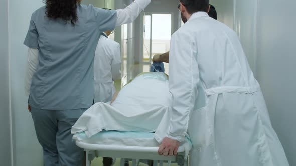 Paramedics Transporting Emergency Patient in Hospital