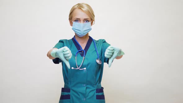 Medical Doctor Nurse Woman Wearing Protective Mask and Latex Gloves - Showing Big Thumb Down