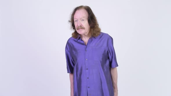 Senior Man with Mustache Wearing Purple Silky Shirt