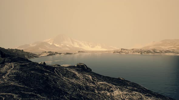 Coastline of Antarctica with Stones and Ice