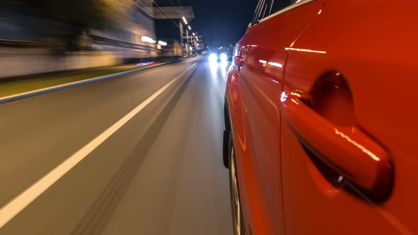 Drivelapse From Side of Car Moving on a Night Avenue in City Timelapse Hyperlapse