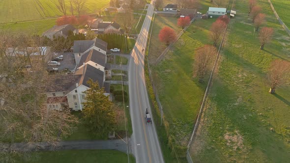 Aerial View of An Amish Horse and Buggy Traveling Along a Rural Country Road