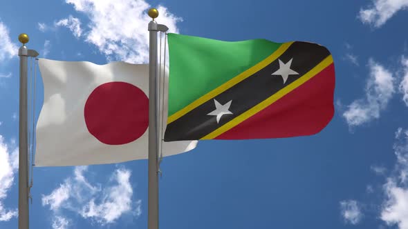 Japan Flag Vs Saint Kitts And Nevis Flag On Flagpole