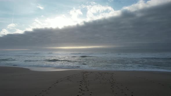 Ocean Waves Splash Into Sandy Beach