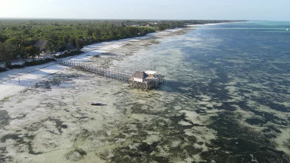 Aerial View of a House on Stilts in the Ocean on the Coast of Zanzibar Tanzania Slow Motion