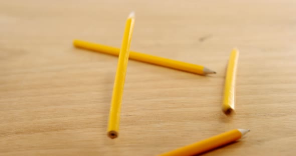 Yellow colored pencils on wooden table