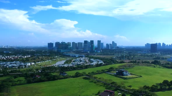 Aerial shots of a landscape with green fields and homes