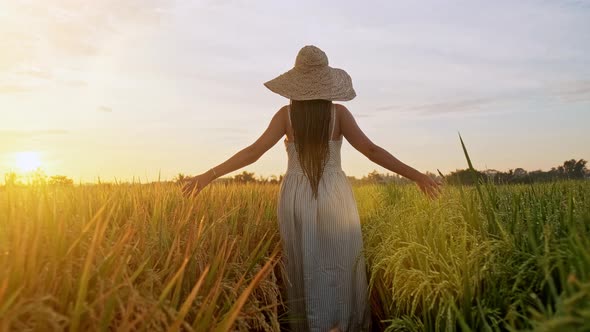 Sensual Young Woman in White Dress Enjoying in Violet Lavender Filed at Beautiful Summer Sunset