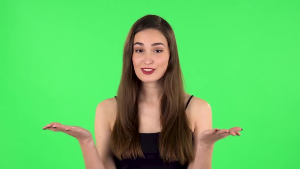 Girl Is Upset, Waving Her Hands in Indignation, Shrugs. Green Screen