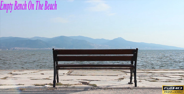 Empty Bench On The Beach