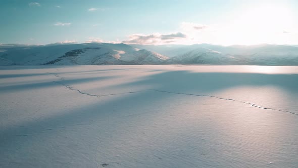 Frozen Lake and Mountains