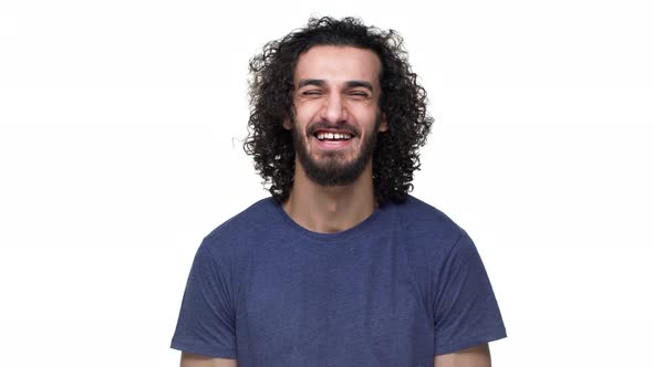 Portrait of Young Football Player with Curly Hair in Casual Dark Blue Tshirt Laughing and Expressing