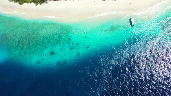 Daytime Above Travel Shot of A White Sand Paradise Beach and Blue Ocean Background