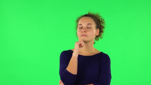 Portrait of Curly Woman Thinking About Something, and Then an Idea Coming To Her. Green Screen