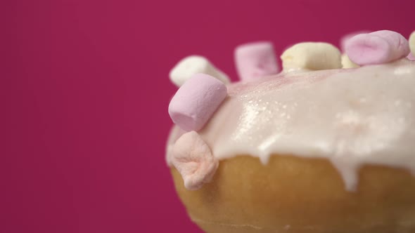 Macro Close Up Footage of Beautiful Delicious White Donut with Marshmallow. Sweets Isolated Rotate