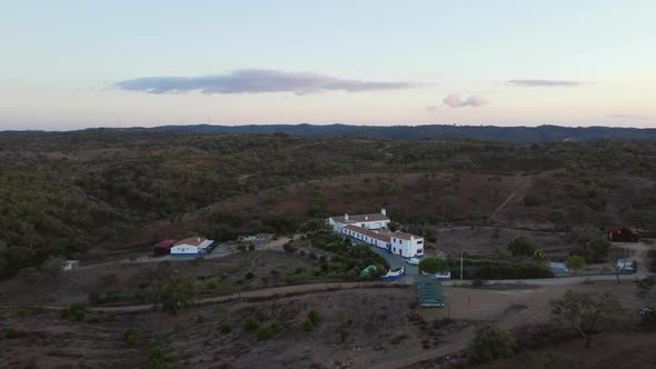 Panorama Of Isolated Farm At The Countryside Of Alentejo In Portugal. aerial, pullback