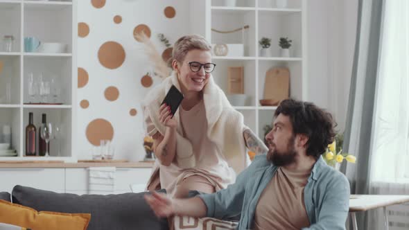 Loving Couple Having Fun while Staying Together at Home