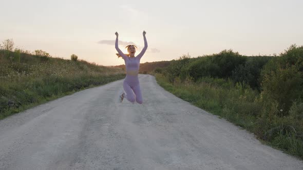 View of a Girl That Jumps and That Dances Outdoor